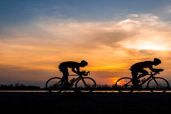 Cyclists in the Sunset