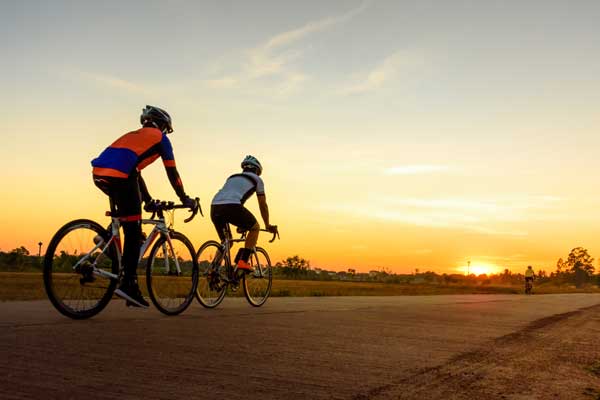 Cyclists riding in the evening time