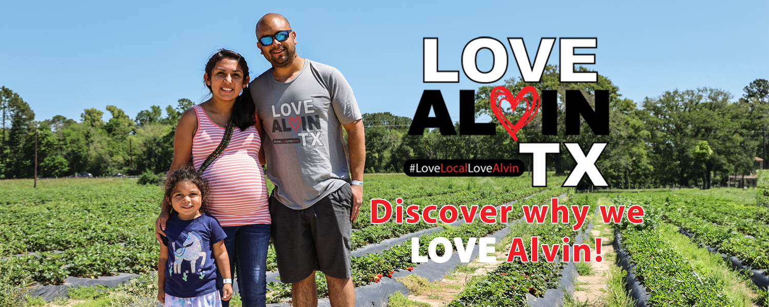 Sweet moments at Froberg Farms Strawberry Festival: A family of three smiles amidst the vibrant fields of strawberries, creating memories that are as delightful as the juicy fruits they pick